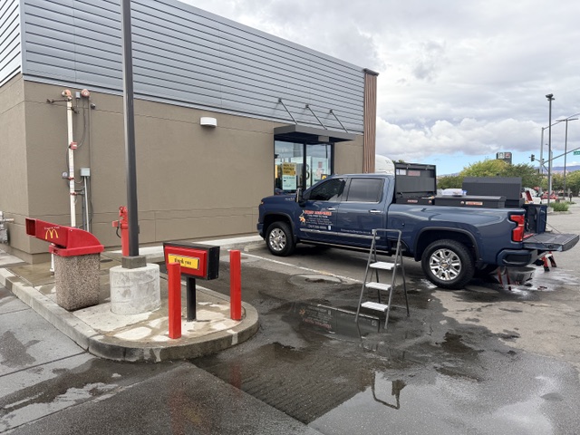 First Response truck on site servicing the fire hydrant and fire department connection at a restaurant drive-thru